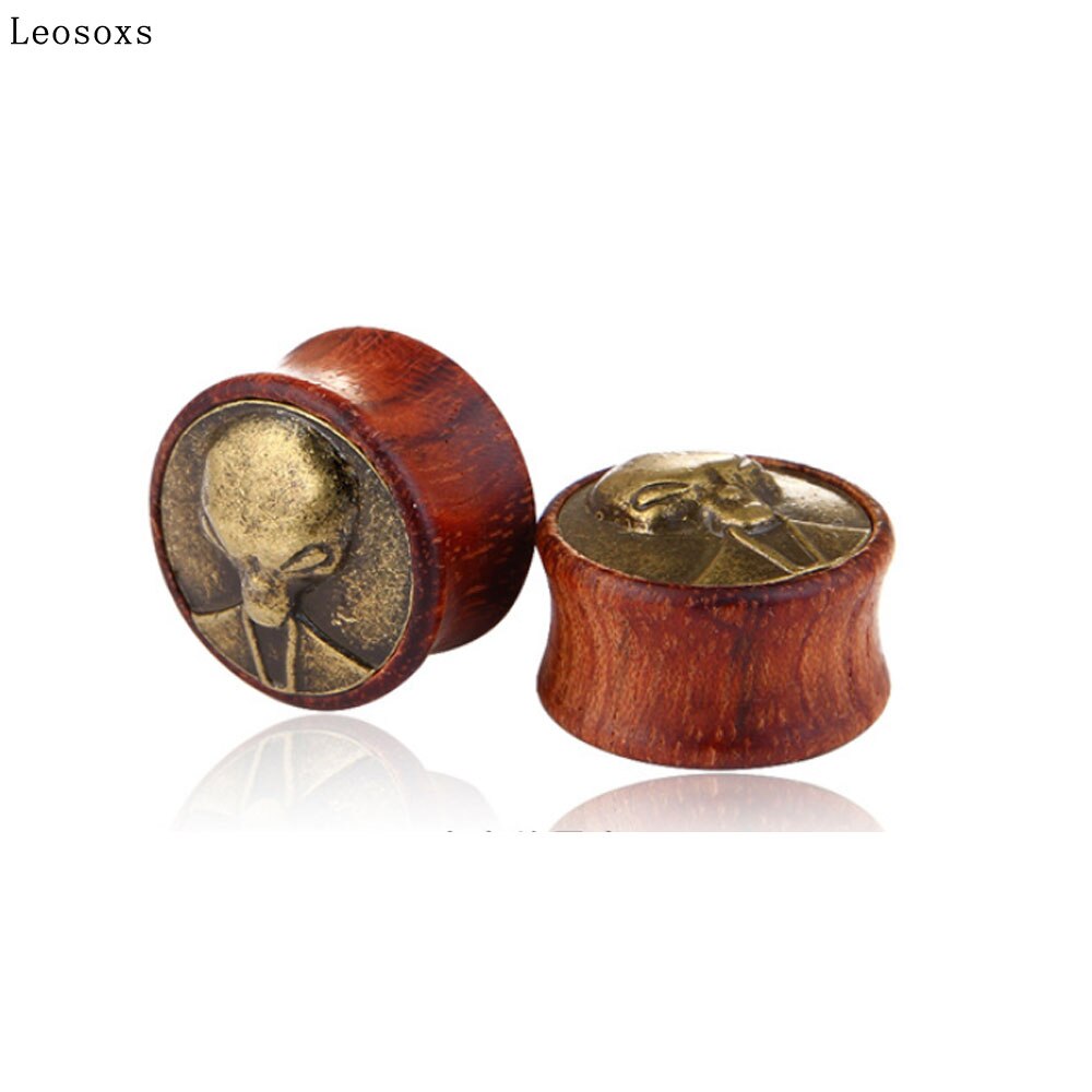 A Pair Of Wooden Expander Earrings With Alien Head Design